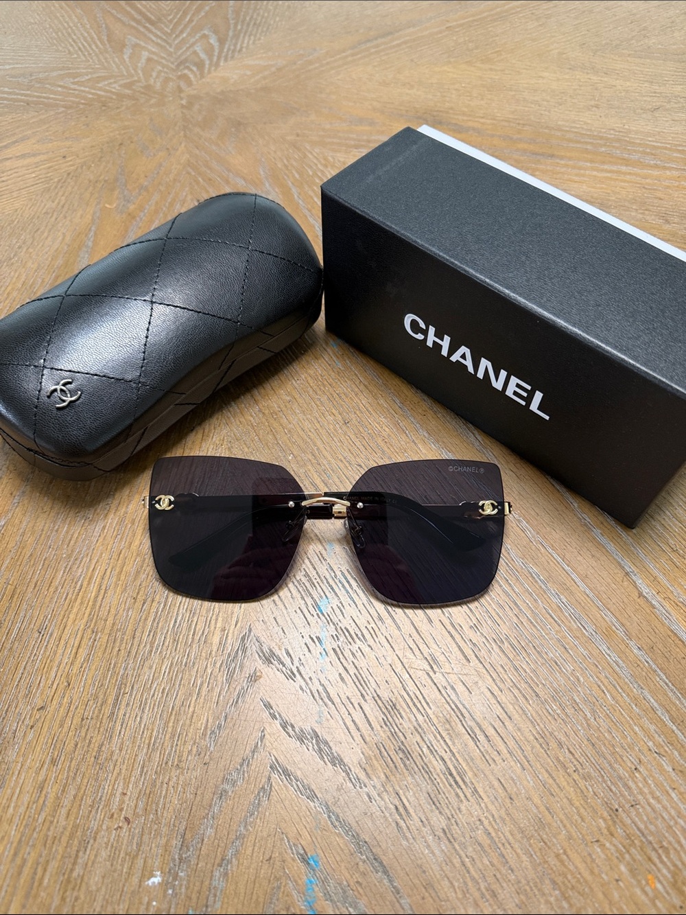 CHANEL Women's Black Gradient Square Rimless Sunglasses with Gold Accents